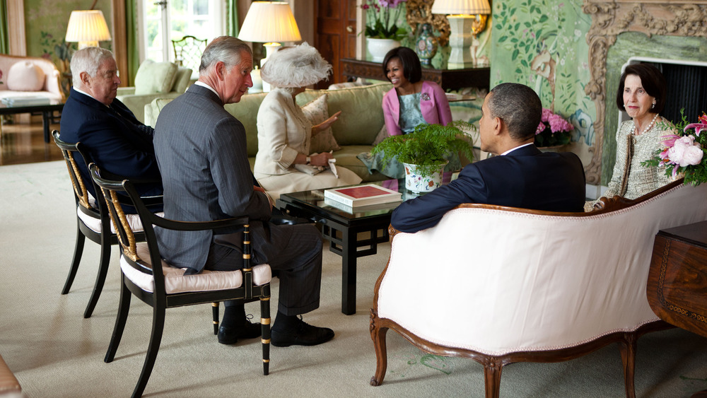 President Barack Obama and First Lady Michelle Obama greet the Prince of Wales and the Duchess of Cornwall, U.S. Ambassador Louis Susman and Mrs. Margaret Susman at Winfield House in London, England, May 24, 2011.