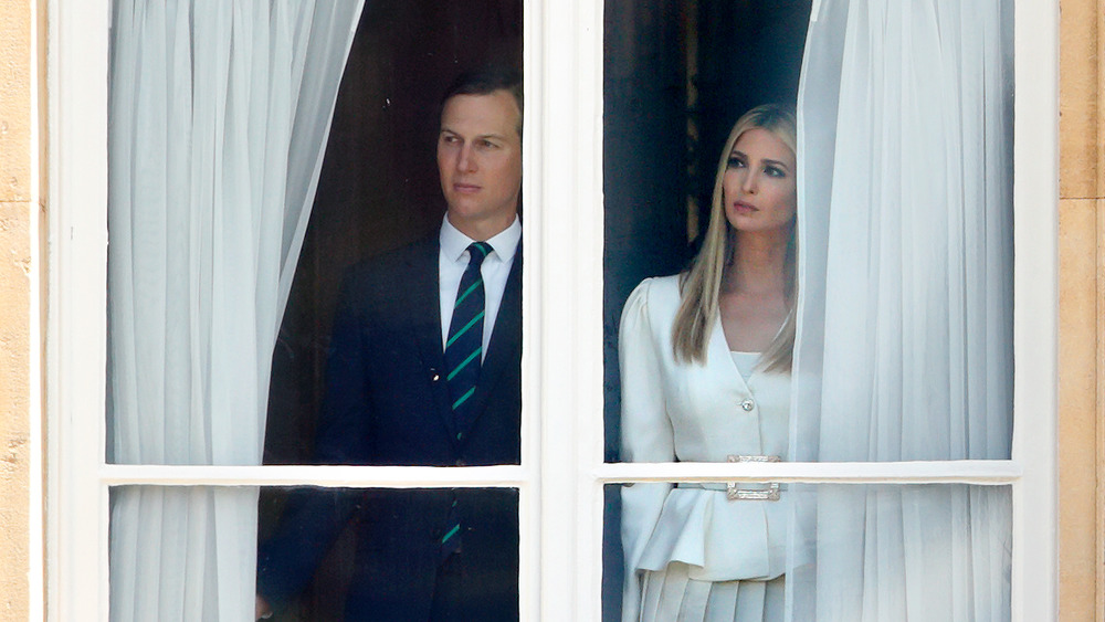 Ivanka Trump and Jared Kushner at window