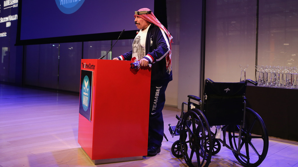 The Iron Sheik with a wheelchair