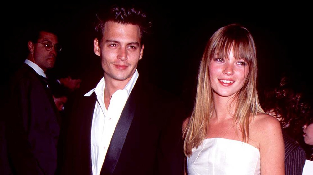 Johnny Depp and Kate Moss smiling 