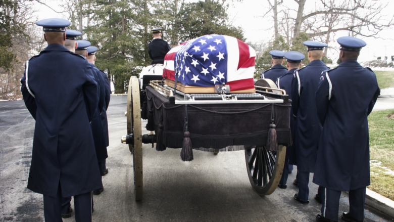 Arlington National Cemetery funeral with flag-draped casket