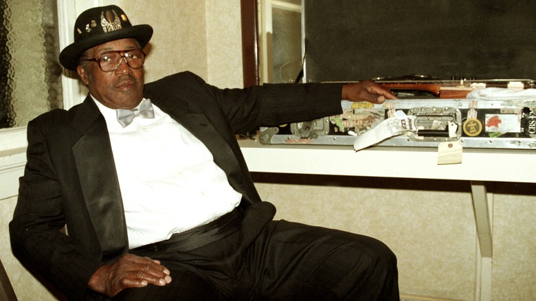 Bo Diddley relaxes backstage