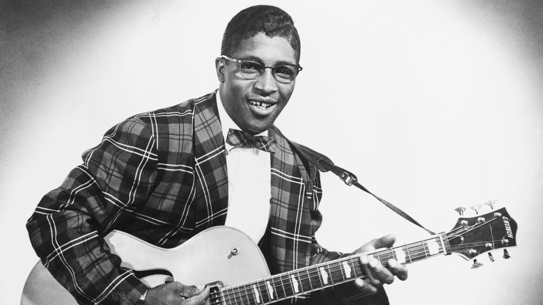 Young Bo Diddley with a guitar