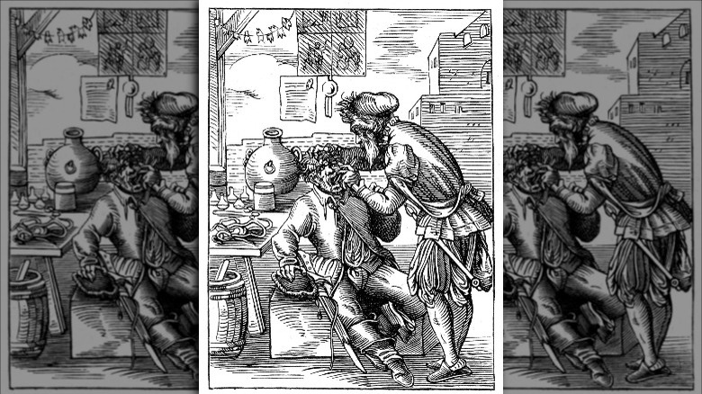 16th century dentist pulling teeth