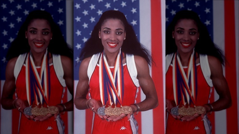 Florence Griffith-Joyner posing with medals