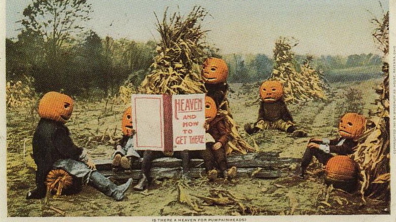 Postcard of people with pumpkin heads reading a book titled Heaven and How to Get There