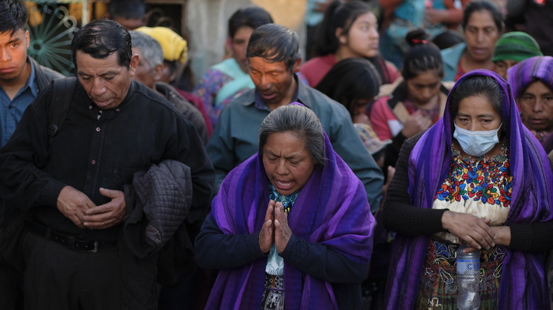 Guatemalans pray together