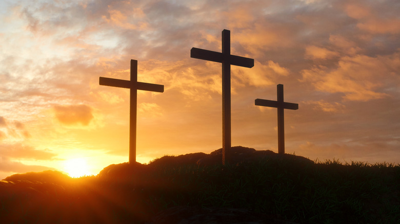 three crosses in the sunset, representative of Golgotha