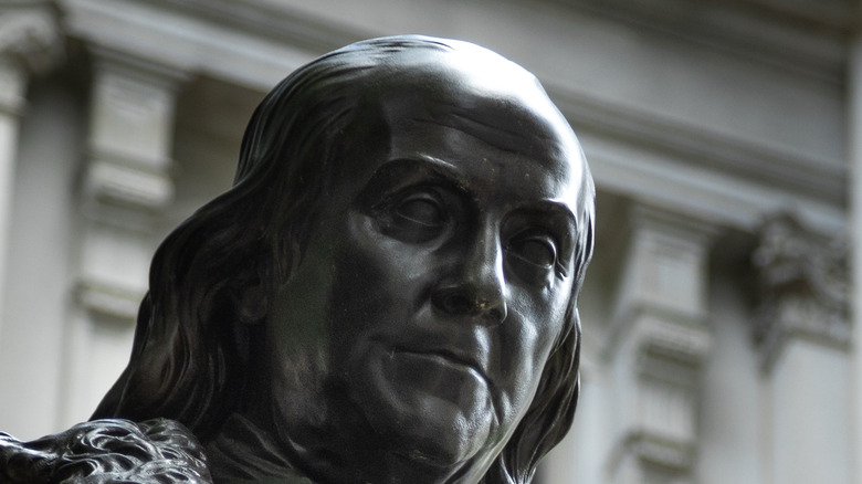 Benjamin Franklin statue looking down