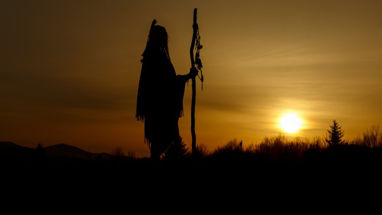 native american standing sunset