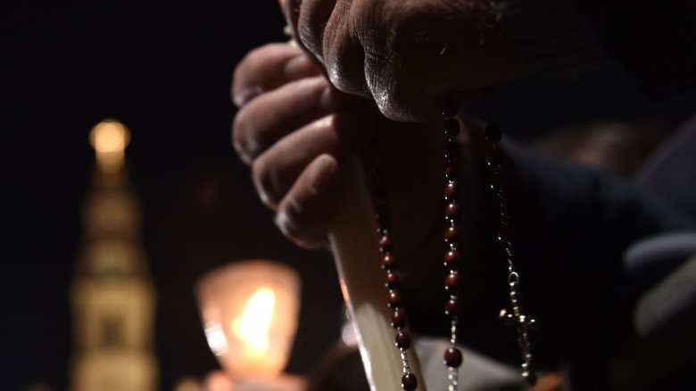catholic rosary being held