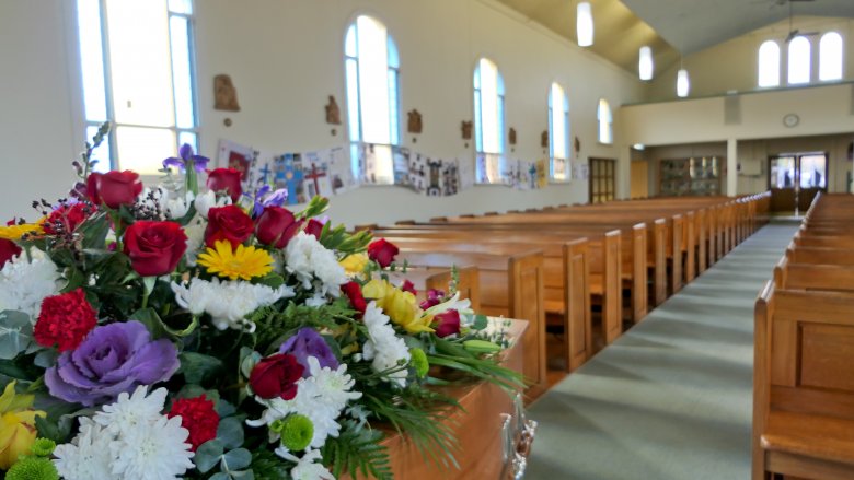 funeral flowers church pews