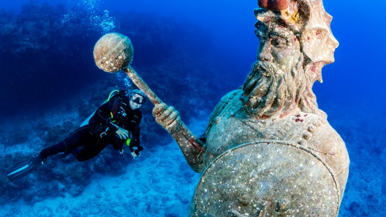 underwater statue, scuba diver