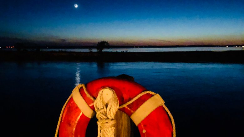 life raft at night ship