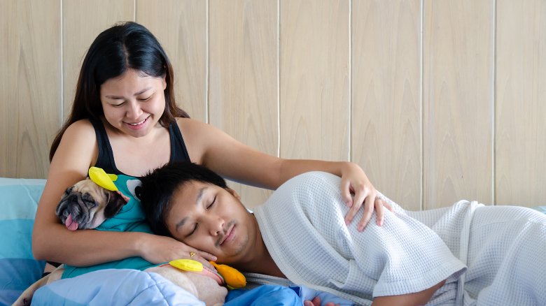 Asian couple cuddling