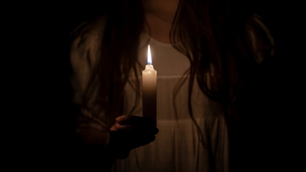 Woman with candle, royal ghosts of Great Britain