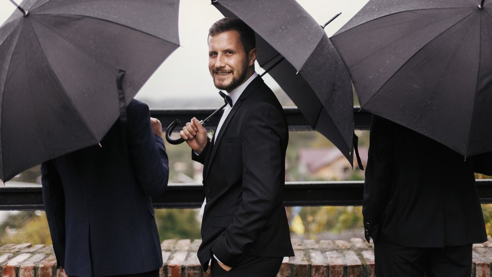 Dapper man with umbrella