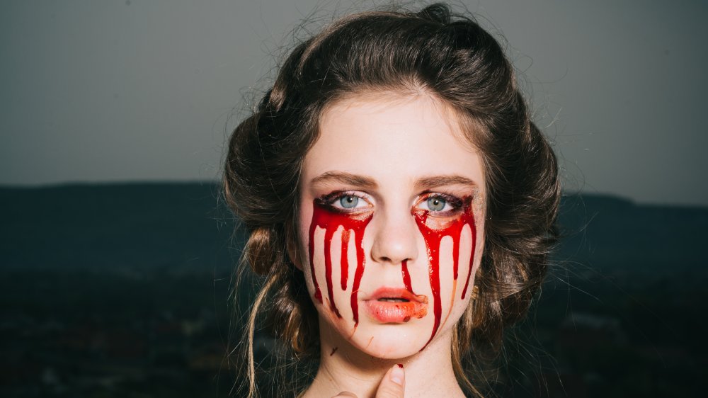 Woman with bloody makeup