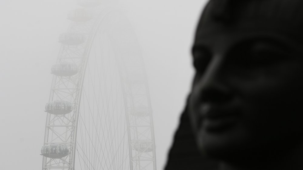 Sphinx with London Eye in foggy background