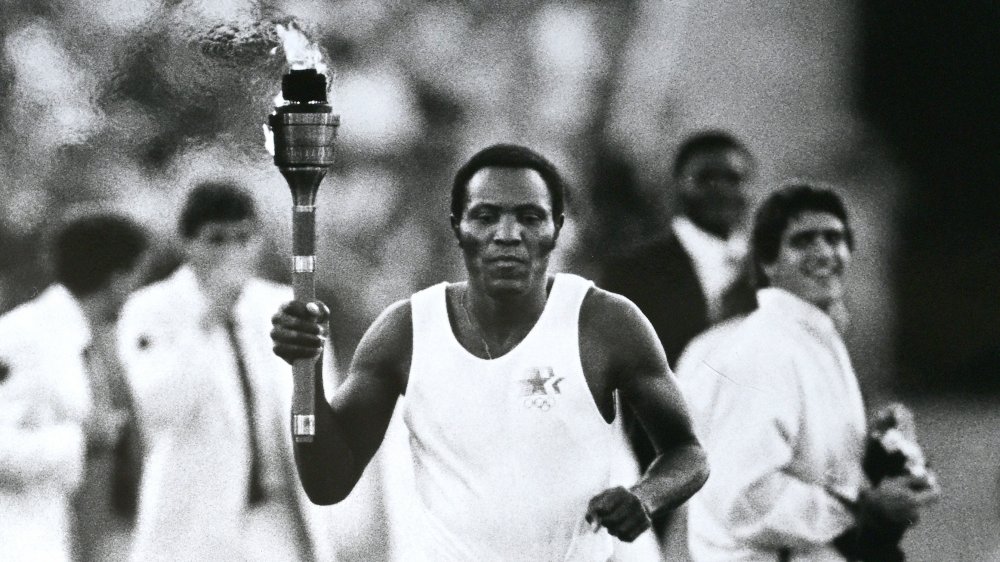 Rafer Johnson carries the torch