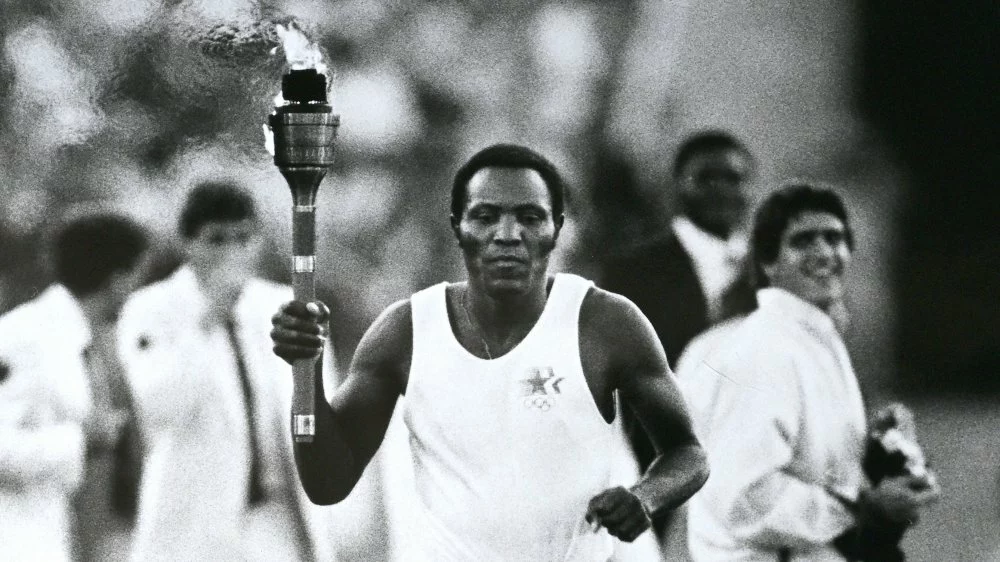 Rafer Johnson carries the torch