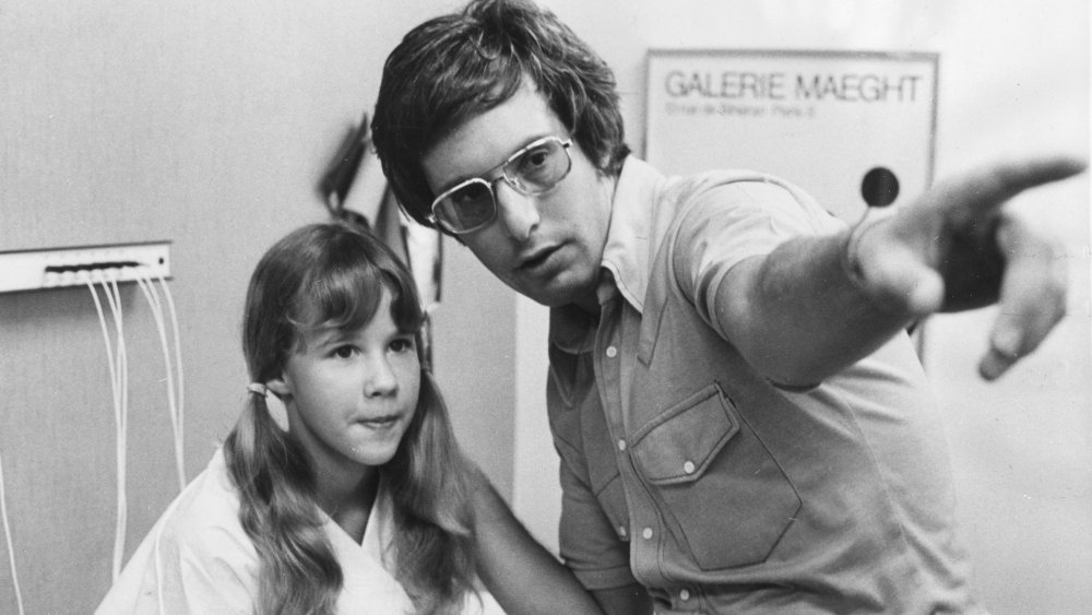 Linda Blair with William Friedkin on set