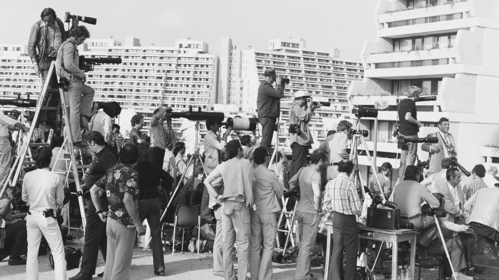 Press gathers outside Munich Olympic Village