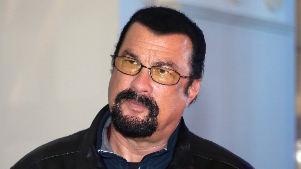 A picture of Steven Seagal wearing yellow glasses