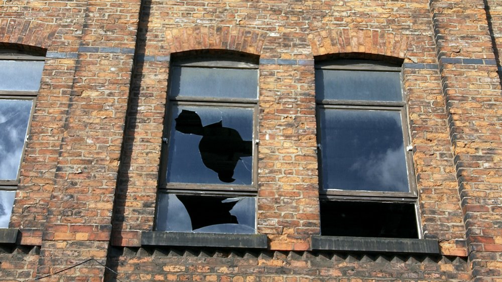 Broken window in old building