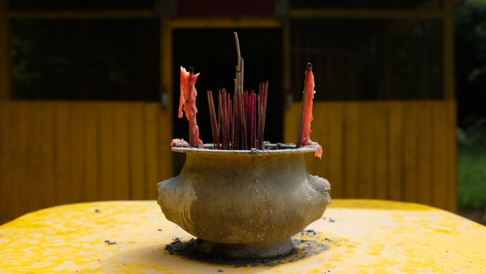 Incense offerings in a shrine at Pulau Ubin, Singapore