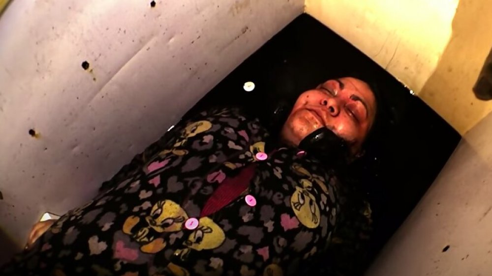 A screenshot of Amy Milligan inside McKamey Manor