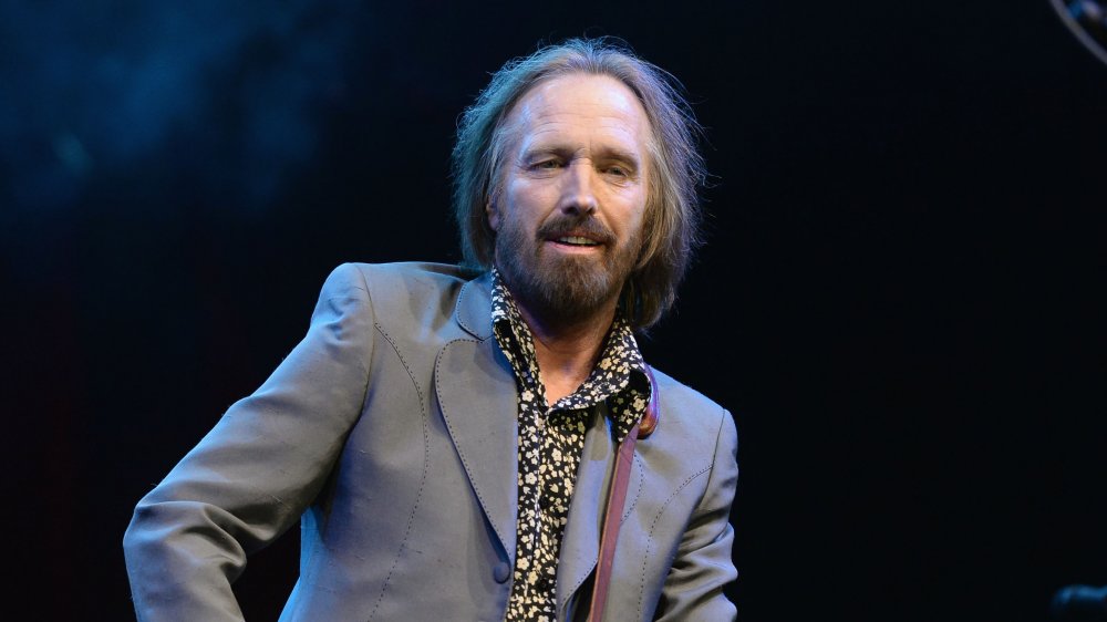 A profile shot of Tom Petty with a guitar