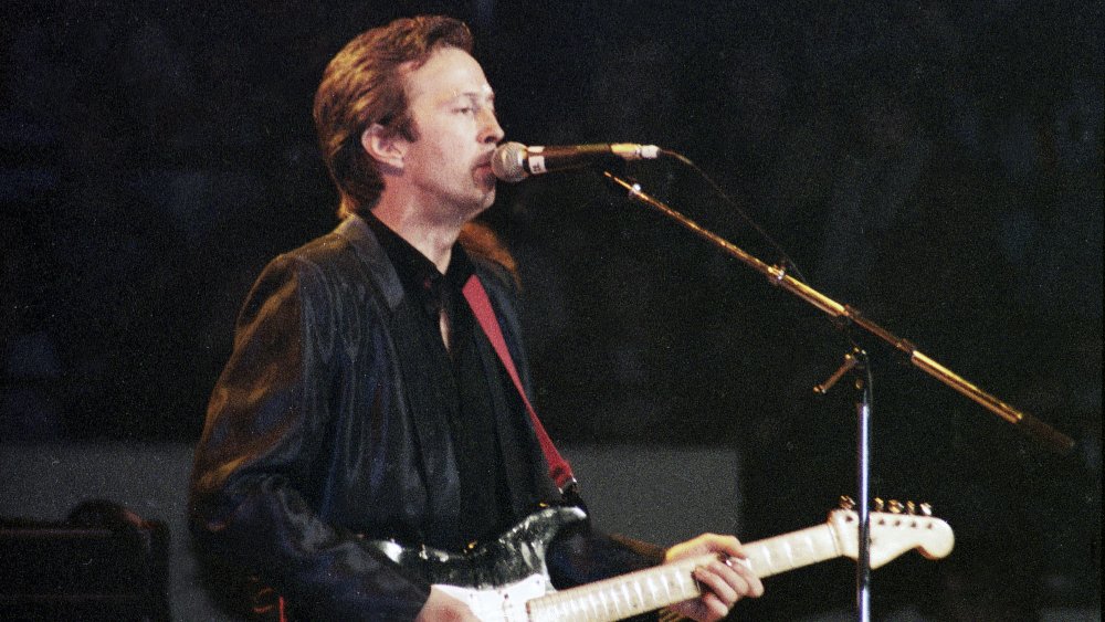 Eric Clapton pictured in a concert with his guitar