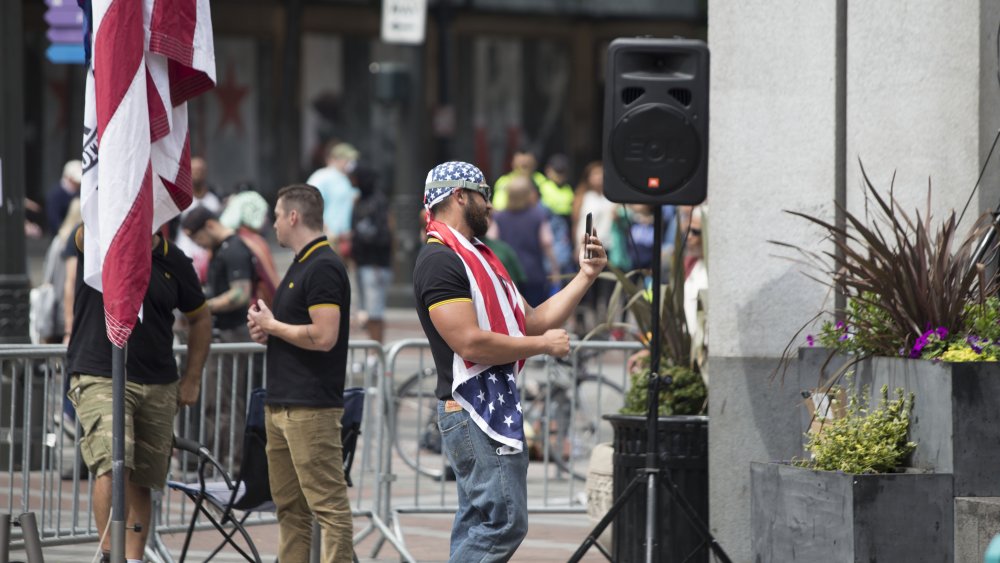 Joey Gibson, founder of Patriot Prayer, at a demonstration in Seattle. Proud Boys members can be seen next to him.