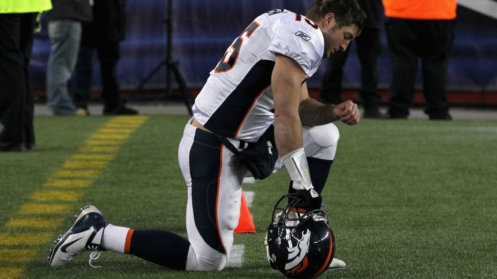 Tebow takes a knee