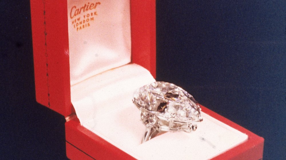 Close-up view of a 69.2 carat Cartier diamond in a red case, which was sold at auction for $1,050,000 in 1969 and subsequently purchased by actor Richard Burton for his wife Elizabeth Taylor.