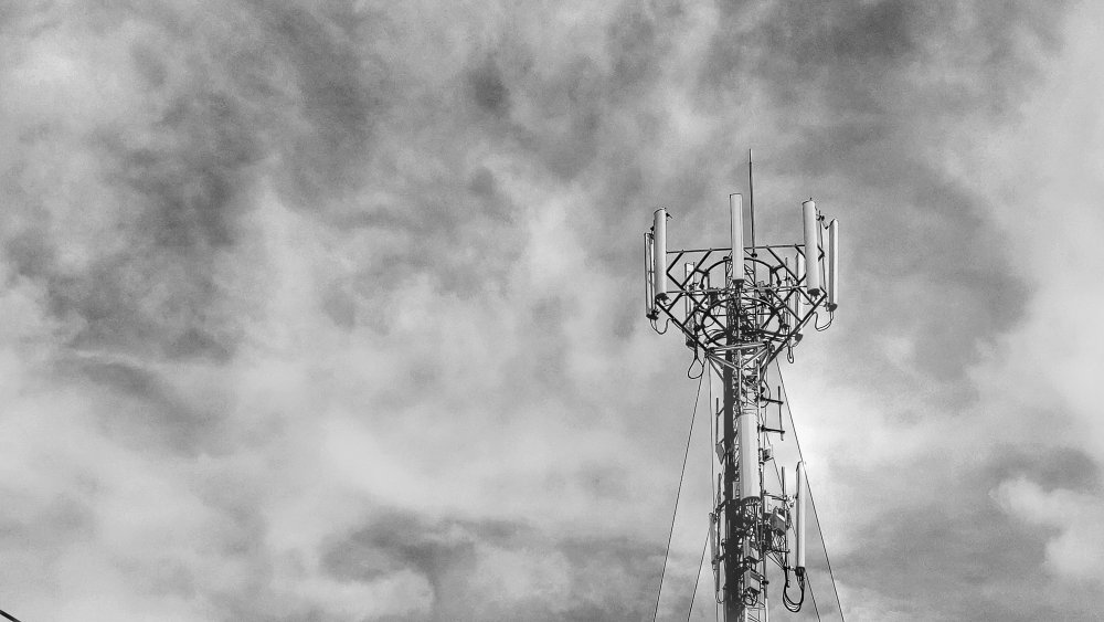 Broadcast tower with cloudy sky