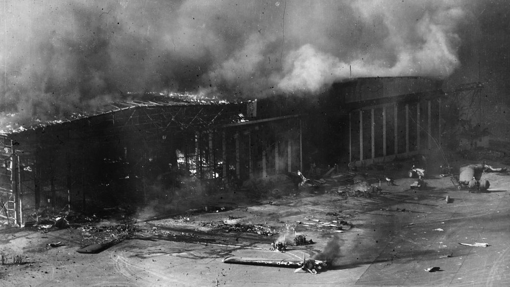 Planes and a hangar burning during the attack on Pearl Harbor