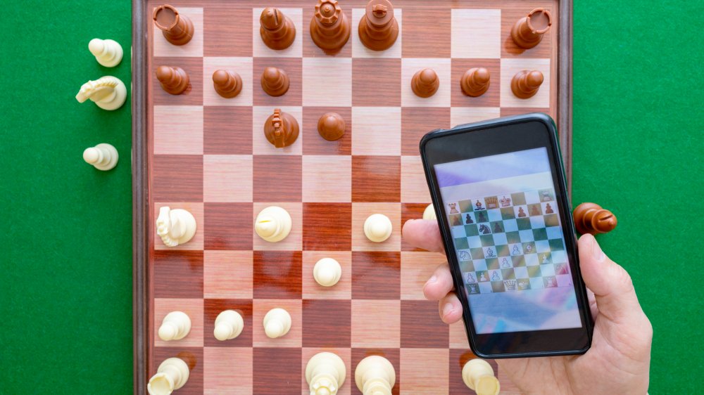 An app that helps train chess players is used during a match
