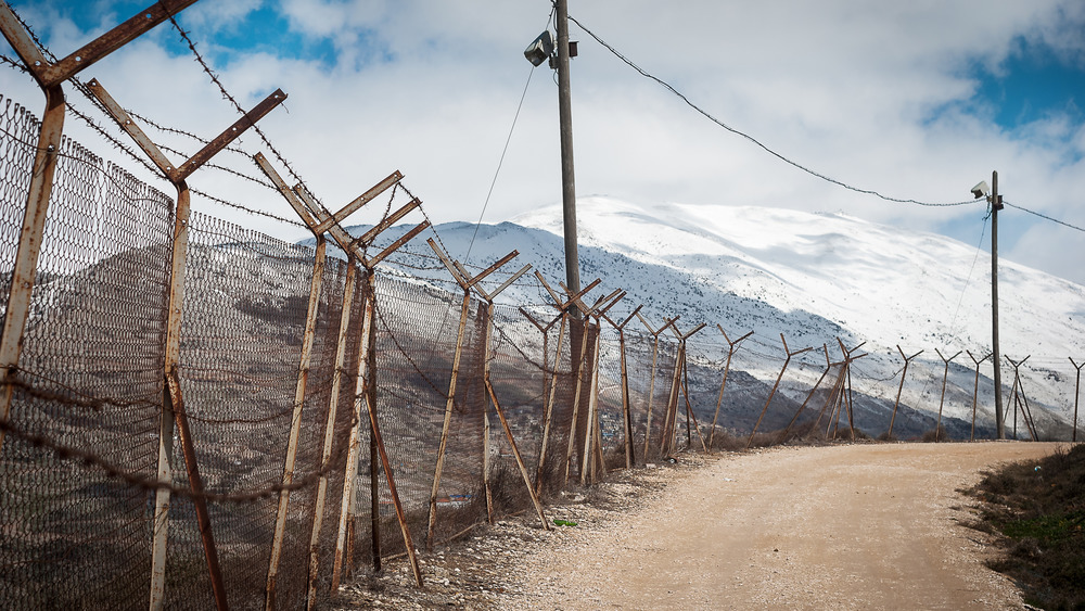 Barbed wire on fence separating Israel from the Golan Heights 