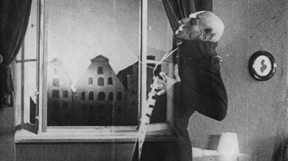 German actor Max Schreck (1879 - 1936), as the vampire Count Orlok, being destroyed by sunlight
