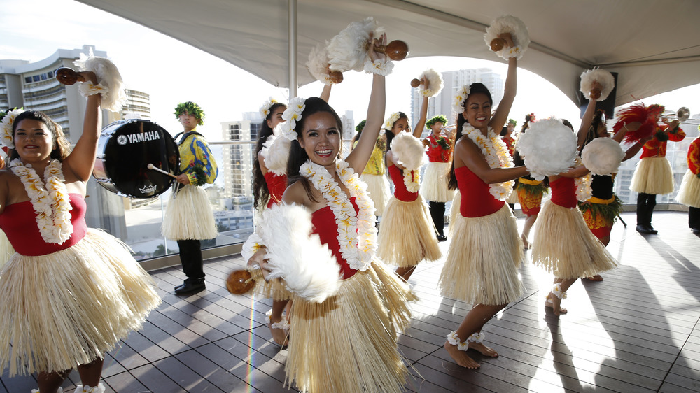 Traditional Hula dancers on a boat
