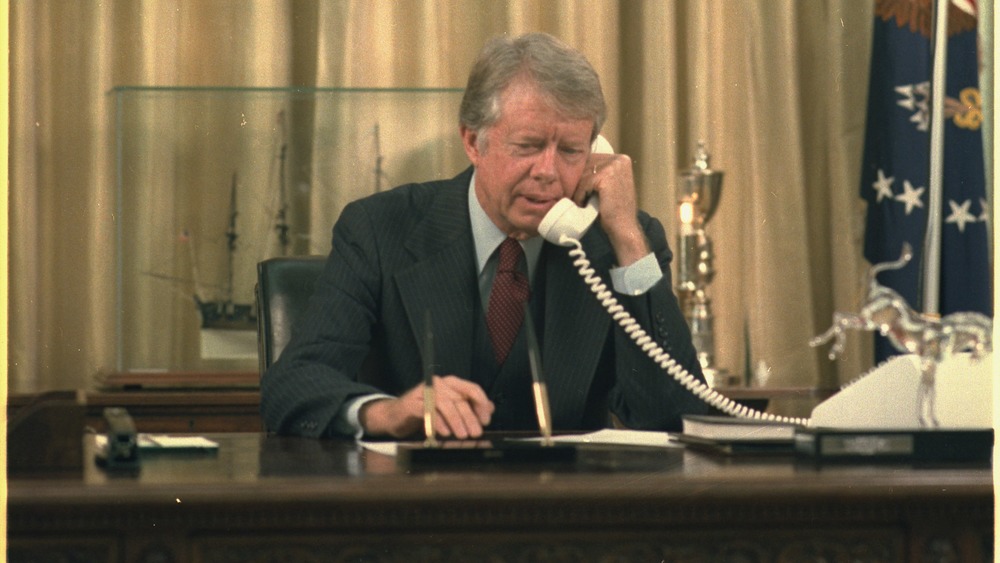 Jimmy Carter on the telephone in the oval office
