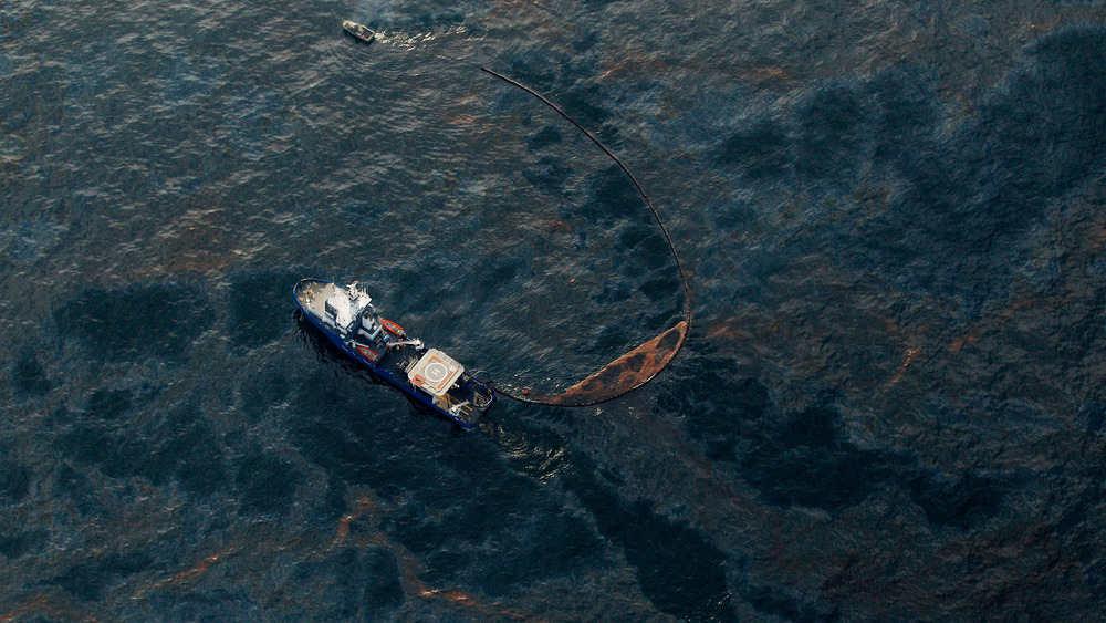 A boat works to collect oil that has leaked from the Deepwater Horizon wellhead in the Gulf of Mexico on April 28, 2010 near New Orleans, Louisiana. 