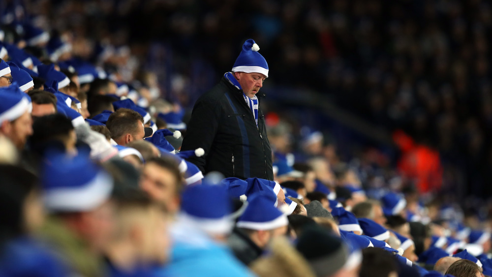 Football fans in blue suits