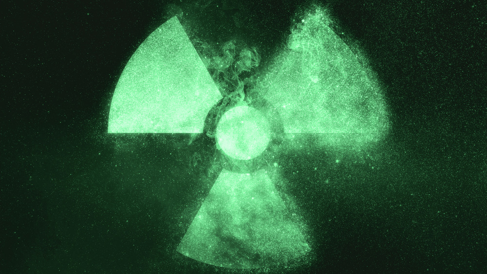 Glowing green radiation symbol 