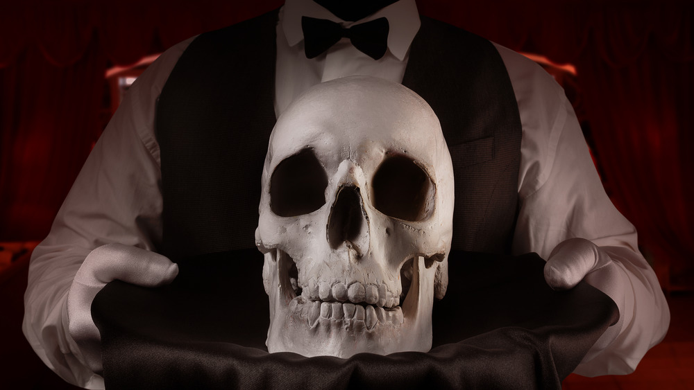 waiter serving skull