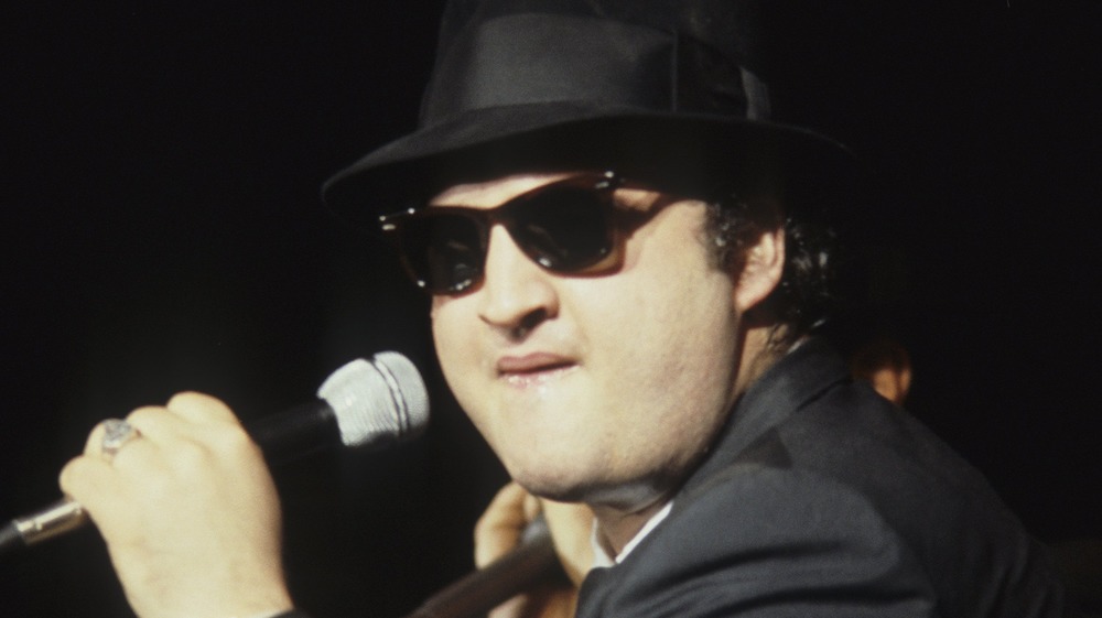 John Belushi as a Blues Brother performing