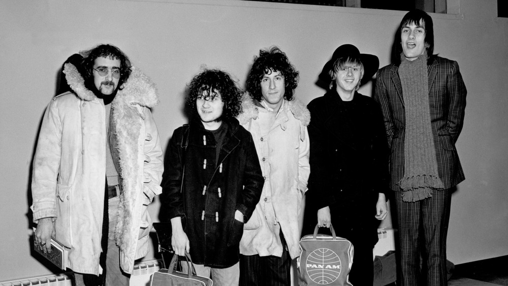 Fleetwood Mac standing in coats