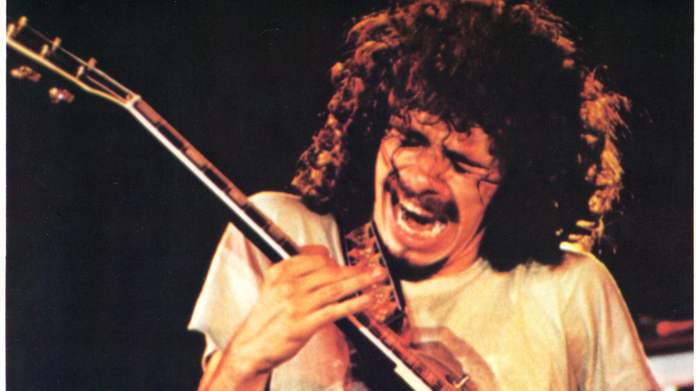 Carlos Santana playing guitar